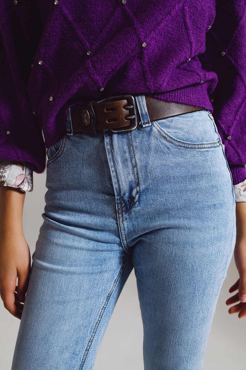 Straight leg jeans with distressed hem in light blue