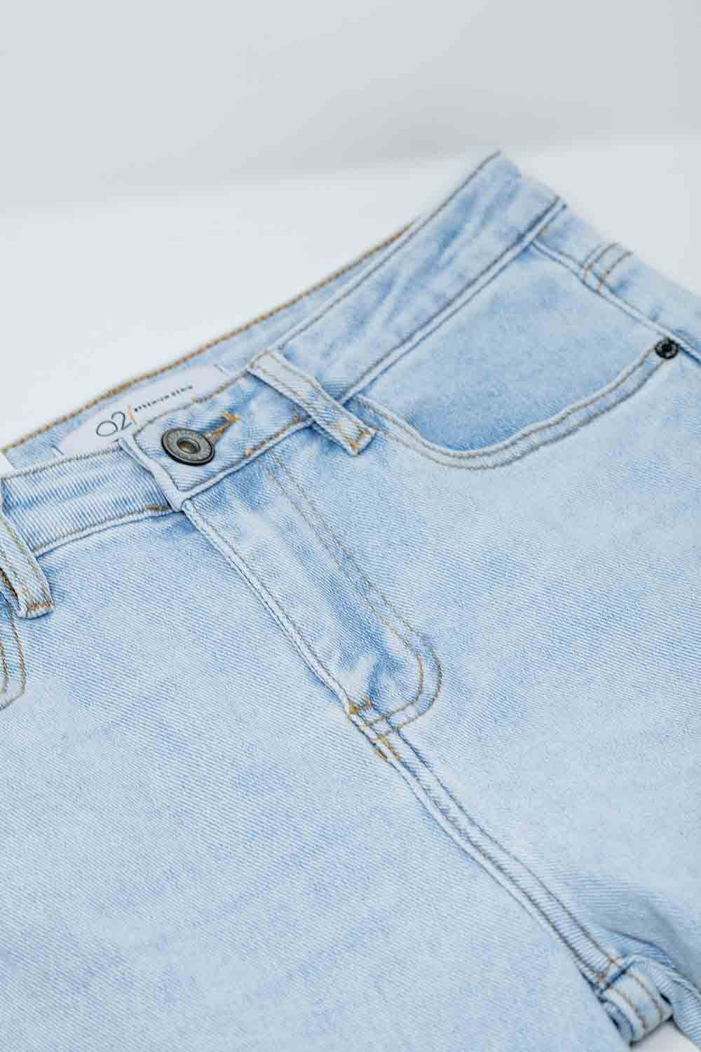 Flared light blue jeans with five pockets and seamless finish