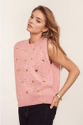 Sleeveless sweater in pink with silver sequin hearts