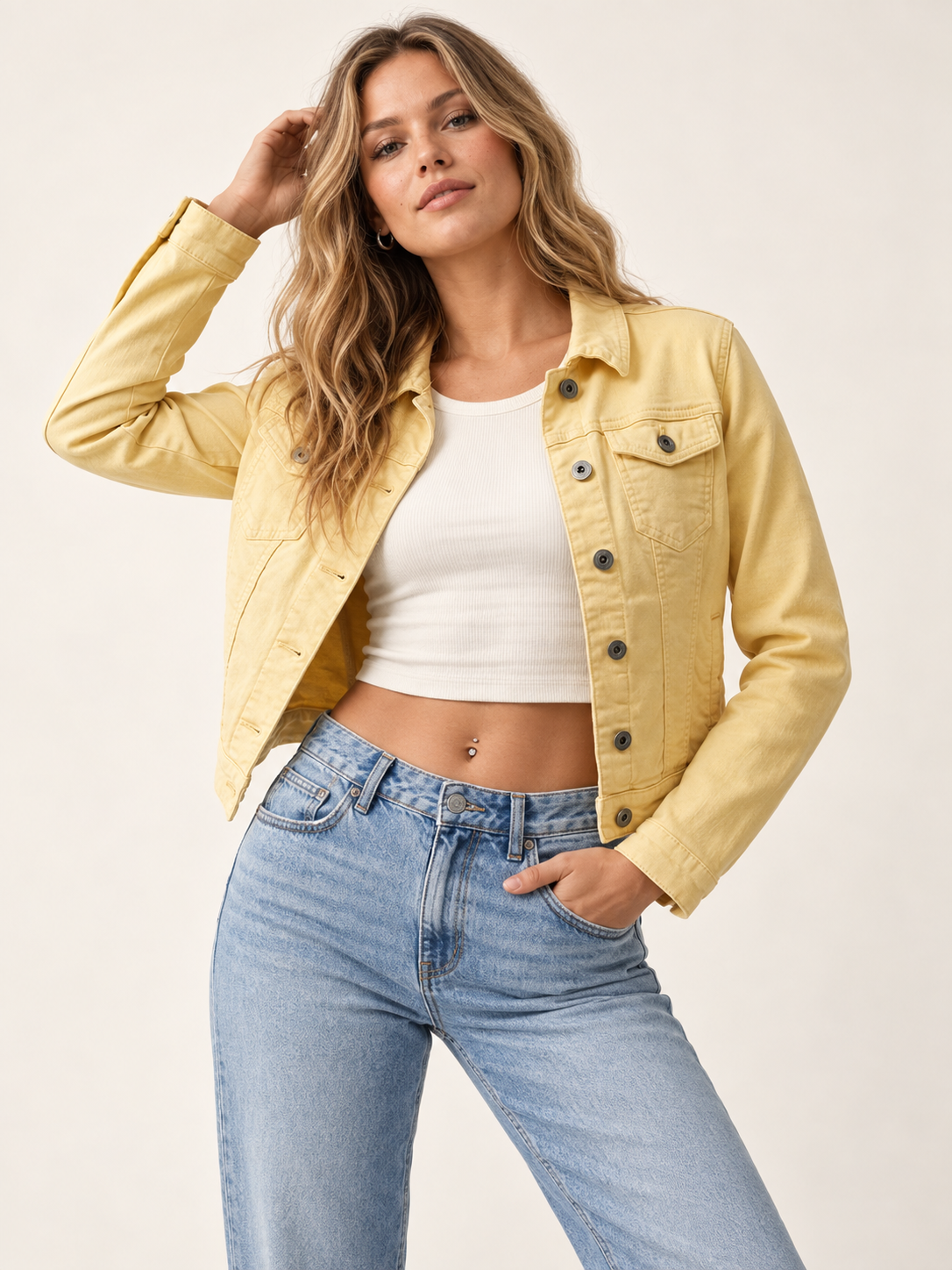 Butter yellow denim jacket on an adult model; ivory top, jeans and accessories are styling only.