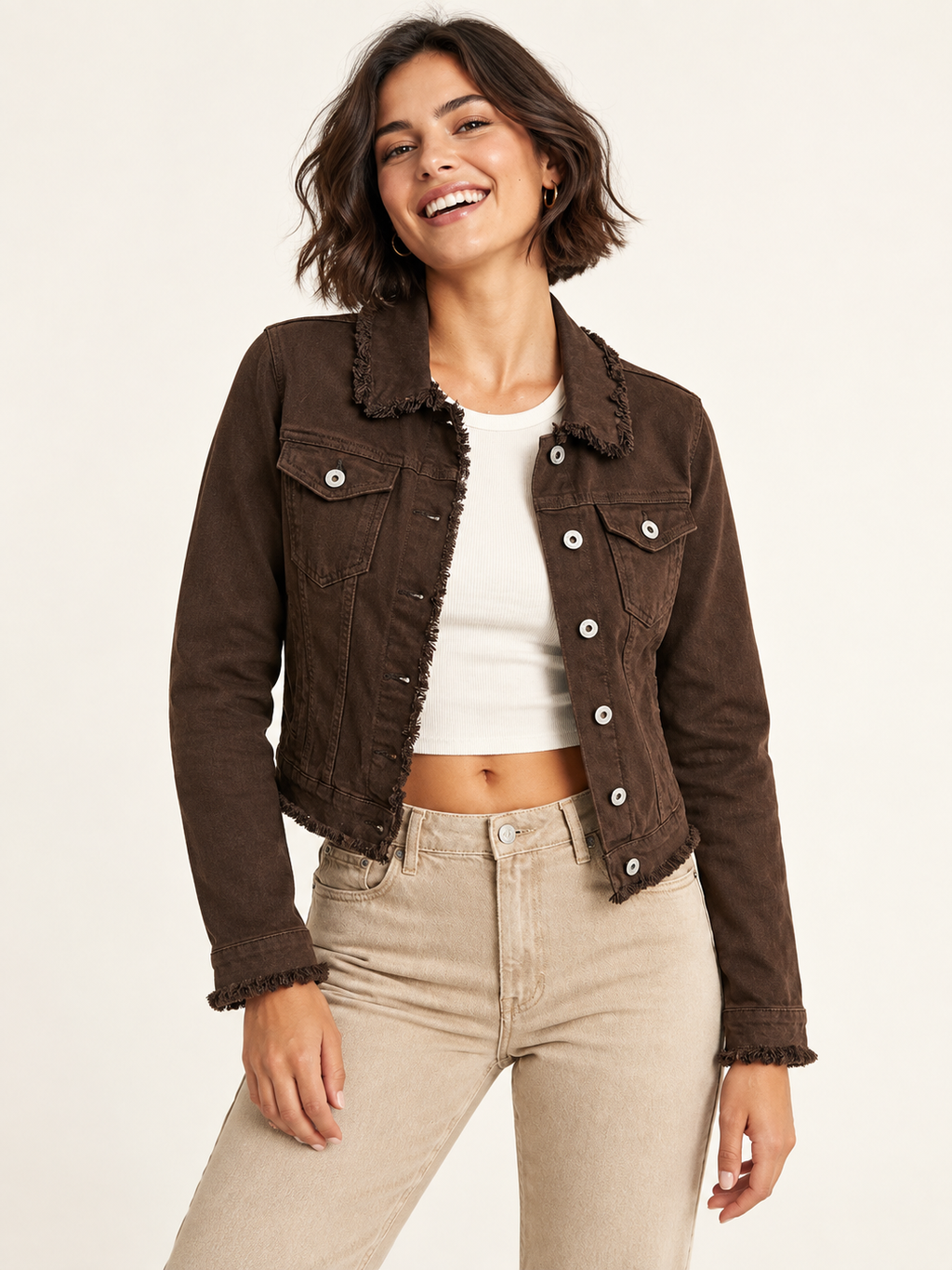 Raw edge denim jacket in chocolate color on an adult model; accessories and other clothing are styling only.