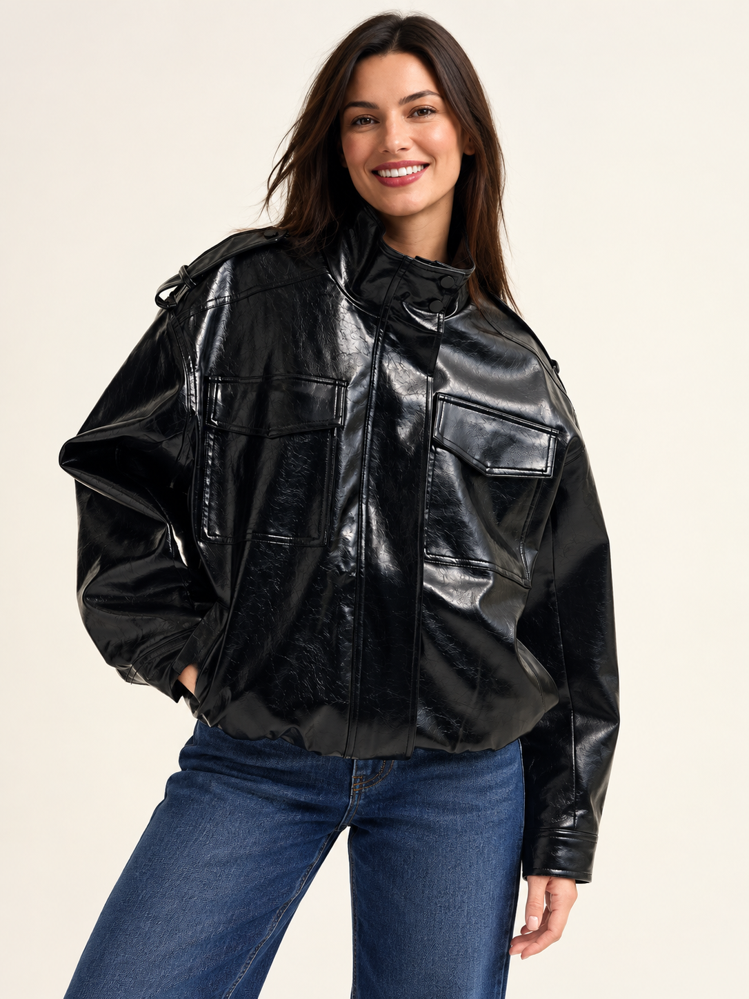 Shiny faux leather oversized Jacket in black on an adult model; accessories and other clothing are styling only.