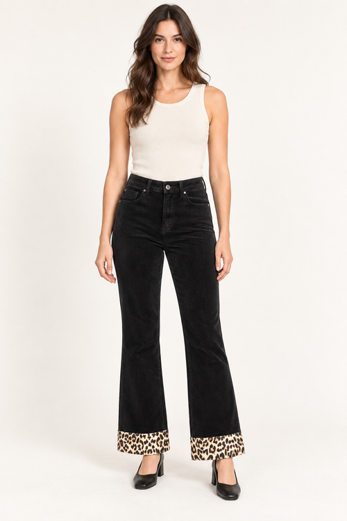 Black corduroy flare pants with leopard print at the bottom — front view, AI-styled model