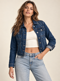 Cropped denim jacket in darkwash blue — front view on an adult model; ivory top and jeans are styling only.